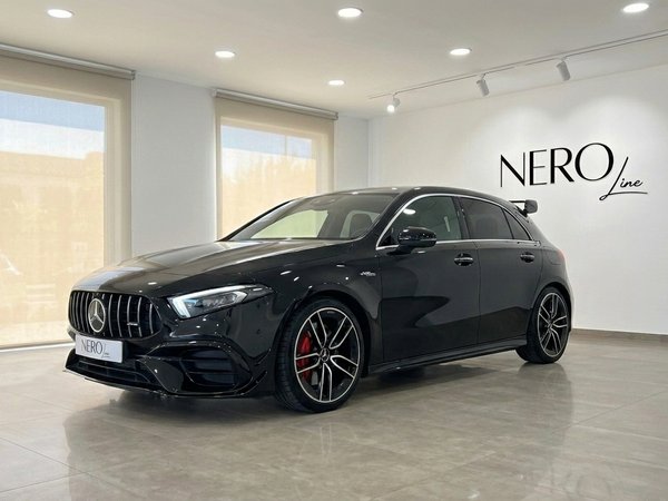 Mercedes-Benz A 35 AMG — Showroom view in Alicante The gloss black Mercedes-Benz A 35 AMG is showcased in a showroom with large windows in Alicante.