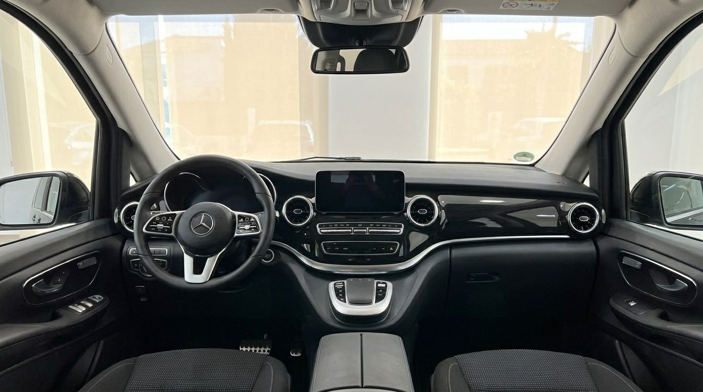 The luxurious interior of the Mercedes-Benz V-Class, showing the cockpit dashboard and steering wheel in Marbella.