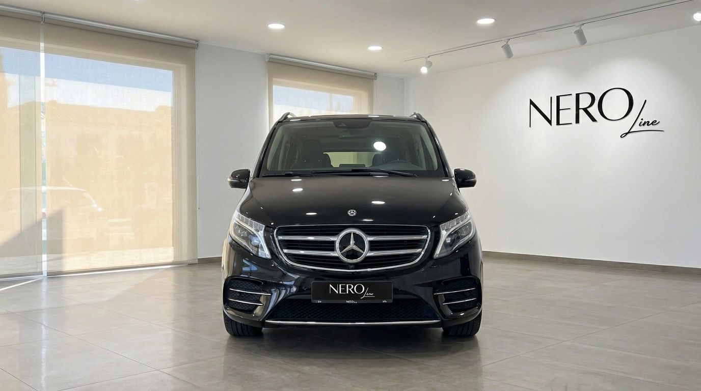 The black Mercedes-Benz V250d Hermes VIP luxury van is shown from the front in a showroom in Barcelona.