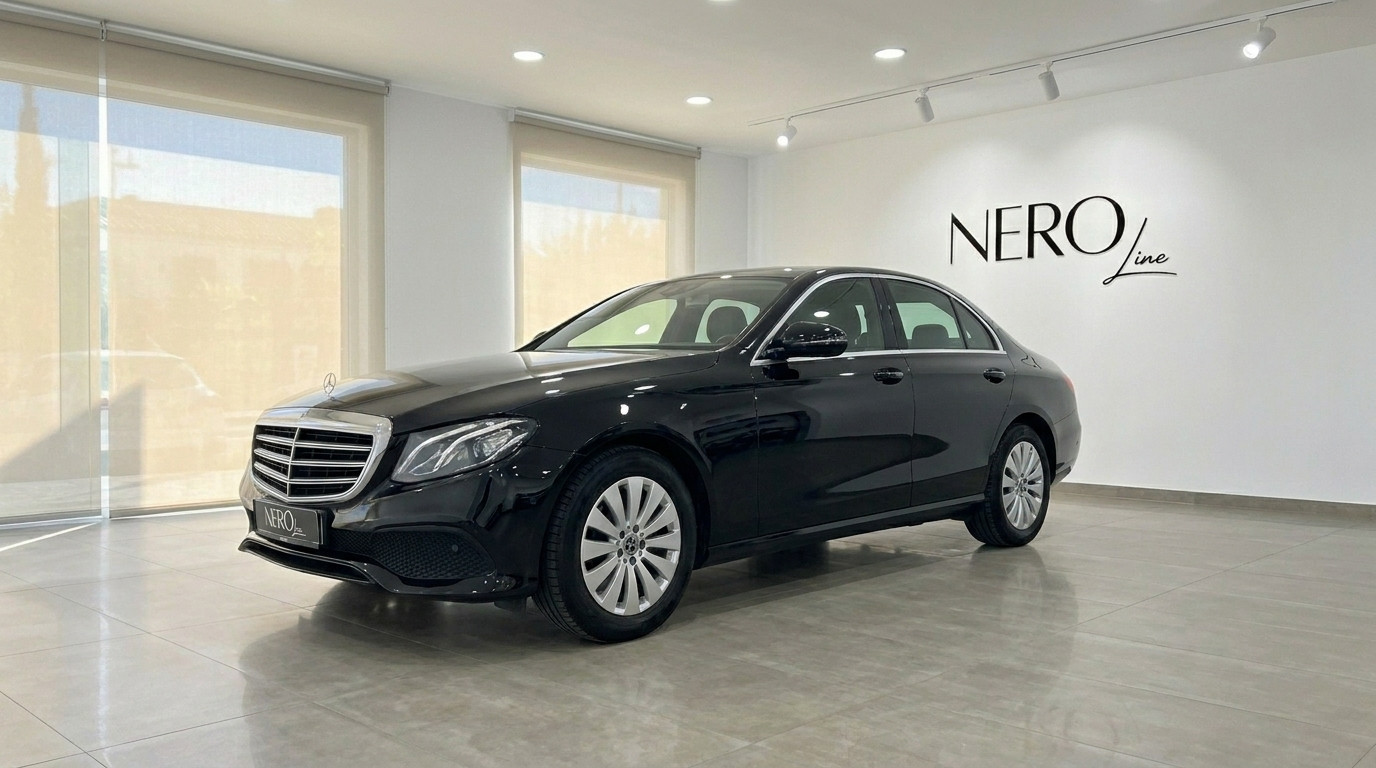 Mercedes-Benz E-Class — Showroom in Alicante A sleek black 2019 Mercedes-Benz E-Class sedan is showcased from a front three-quarter view in a bright Alicante showroom.