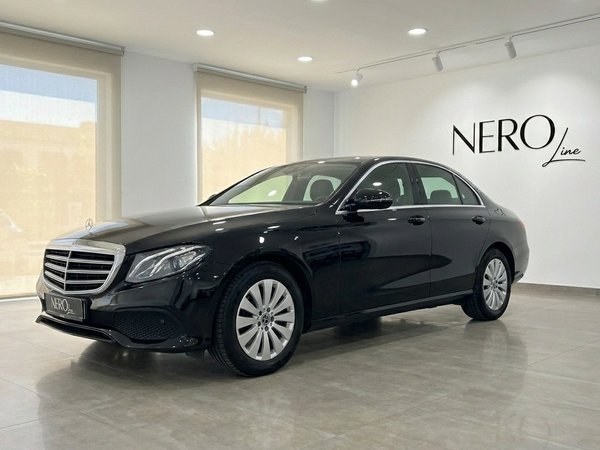 Mercedes-Benz E-Class — Showroom in Alicante A sleek black 2019 Mercedes-Benz E-Class sedan is showcased from a front three-quarter view in a bright Alicante showroom.