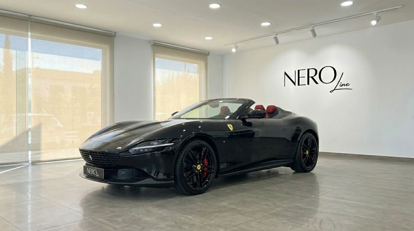 The 2025 Ferrari Roma Spider Black, with its top down and red interior, is showcased in a Madrid showroom.