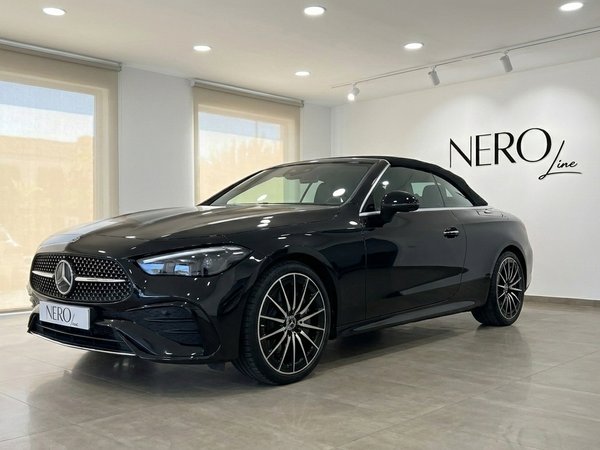 Mercedes-Benz CLE Cabriolet — Marbella showroom The black Mercedes-Benz CLE Cabriolet is showcased from a front three-quarter angle in a bright Marbella showroom.