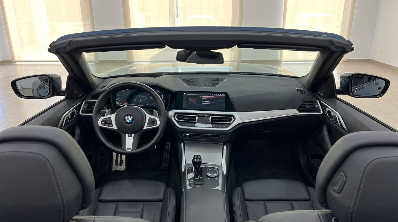 The luxurious interior of the BMW 420 Cabriolet, showcasing its modern dashboard, steering wheel, and front seats in Alicante.