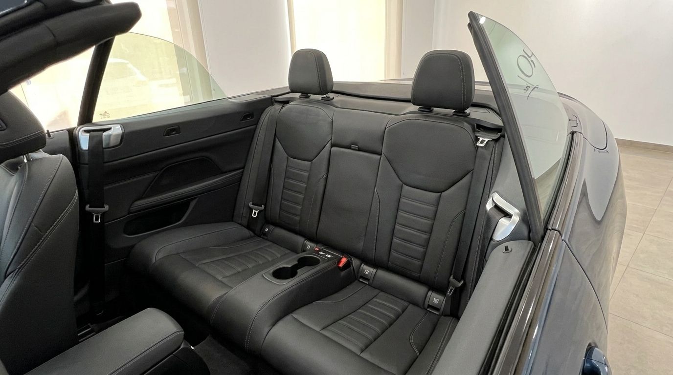The luxurious black leather rear seats and interior of the BMW 420 Cabriolet, available for rent in Alicante.