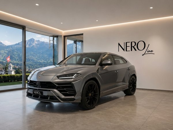 Lamborghini Urus — Showroom view, Zurich mountains A grey Lamborghini Urus is parked in a modern showroom with a panoramic view of the mountains in Zurich.
