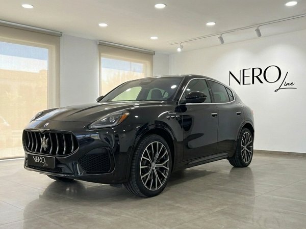 Maserati Grecale — Luxury SUV in Marbella The sleek gloss black 2024 Maserati Grecale is showcased in a front three-quarter view within a modern showroom in Marbella.