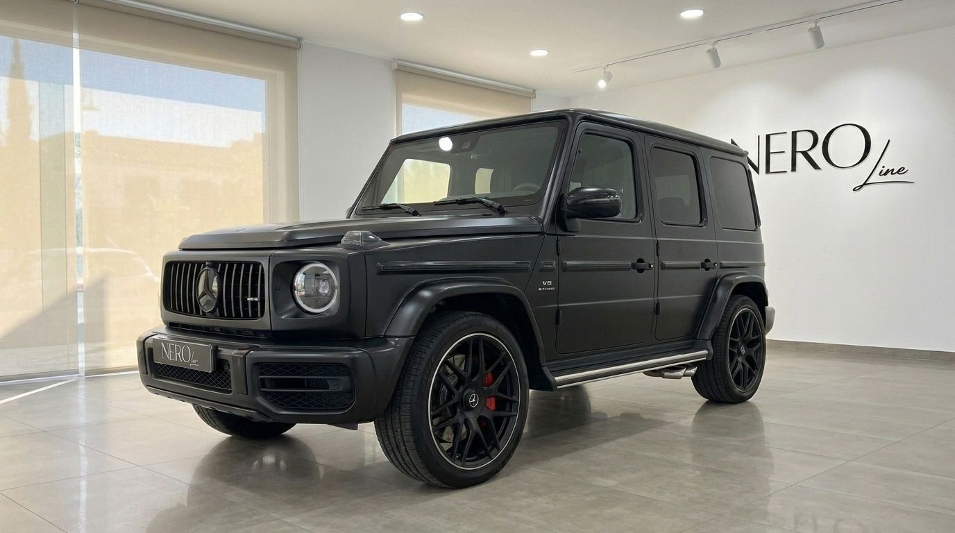 Matte black Mercedes-Benz G63 AMG in a front three-quarter view, parked indoors in Marbella.