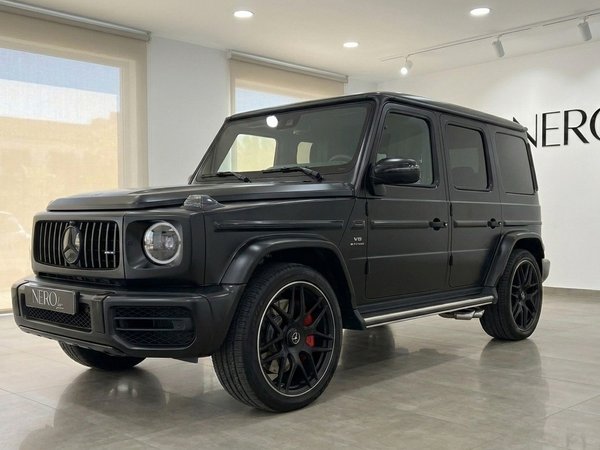 Mercedes-Benz G63 AMG — Front view Marbella Matte black Mercedes-Benz G63 AMG in a front three-quarter view, parked indoors in Marbella.
