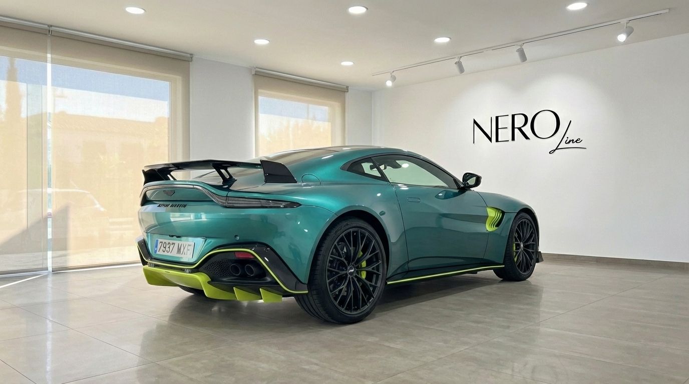 Metallic green Aston Martin Vantage F1 Spec from the rear three-quarter angle, showcasing its spoiler and diffuser in Alicante.