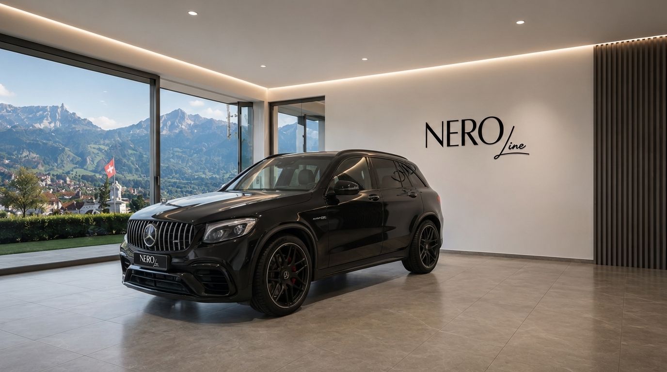 A black Mercedes-Benz GLC 63 AMG SUV is parked in a modern showroom with a stunning mountain view of Zurich.