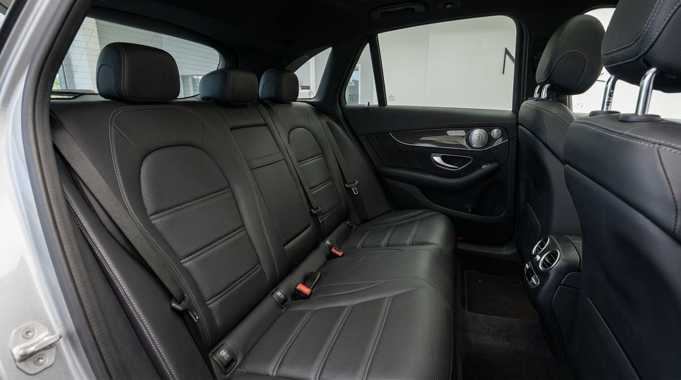 The luxurious black leather rear seats and door panel of the Mercedes-Benz GLC 63 AMG in Zurich.