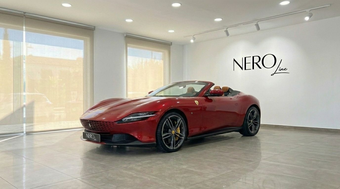 The 2023 racing red Ferrari Roma Spider convertible is showcased in a Barcelona showroom, featuring its elegant front three-quarter view.