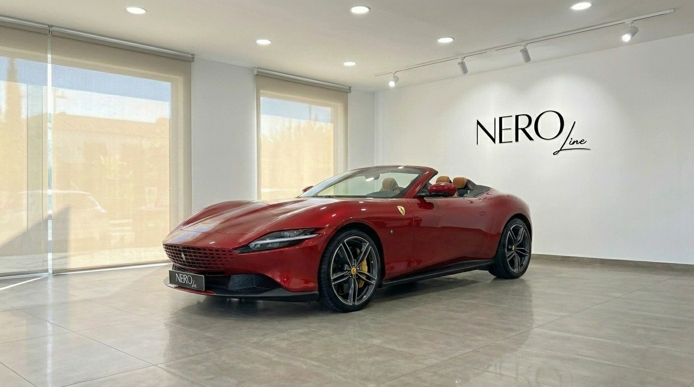 Ferrari Roma Spider — Front three-quarter view Barcelona showroom The 2023 racing red Ferrari Roma Spider convertible is showcased in a Barcelona showroom, featuring its elegant front three-quarter view.