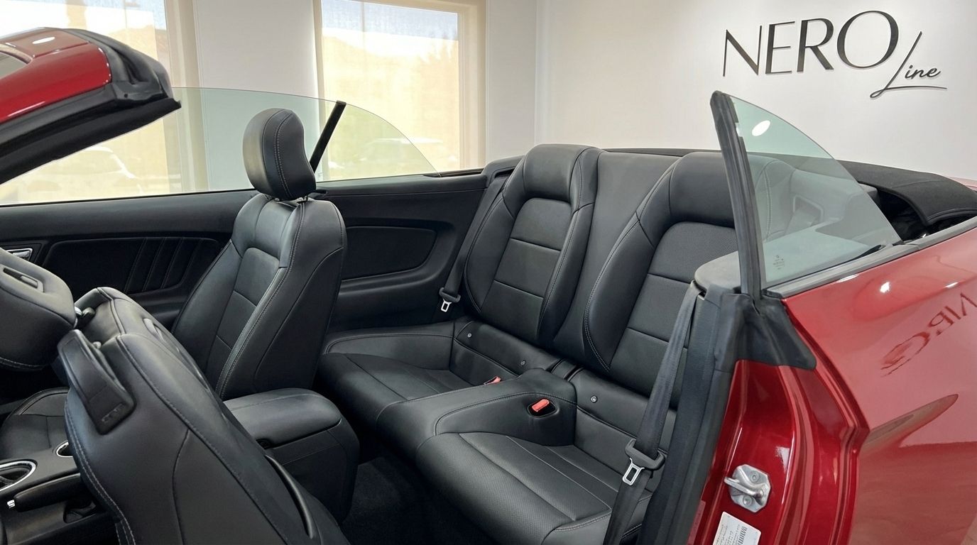 The interior of the 2022 Ford Mustang GT Cabrio in Alicante, showing the black leather front passenger and rear seats.