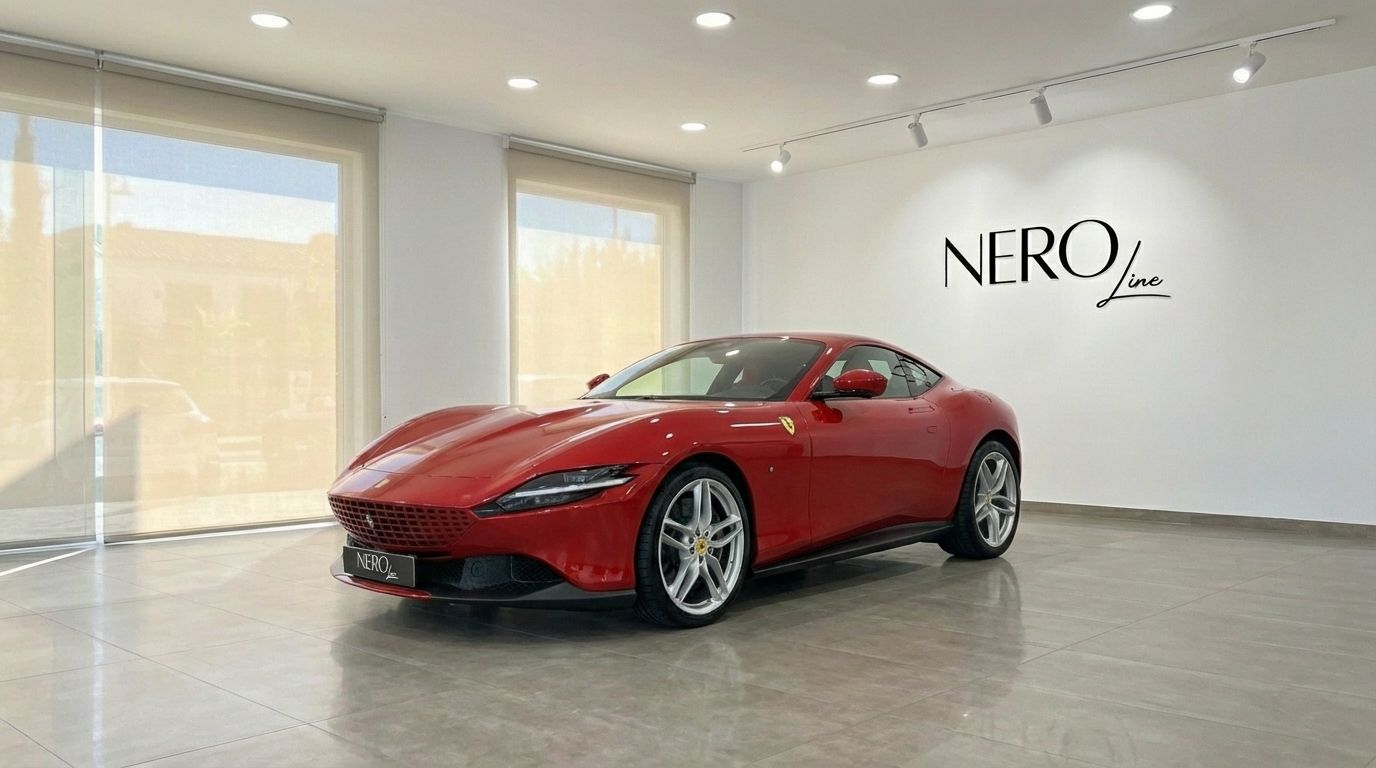 The striking red Ferrari Roma is showcased from a front three-quarter angle inside a modern, brightly lit showroom in Valencia.