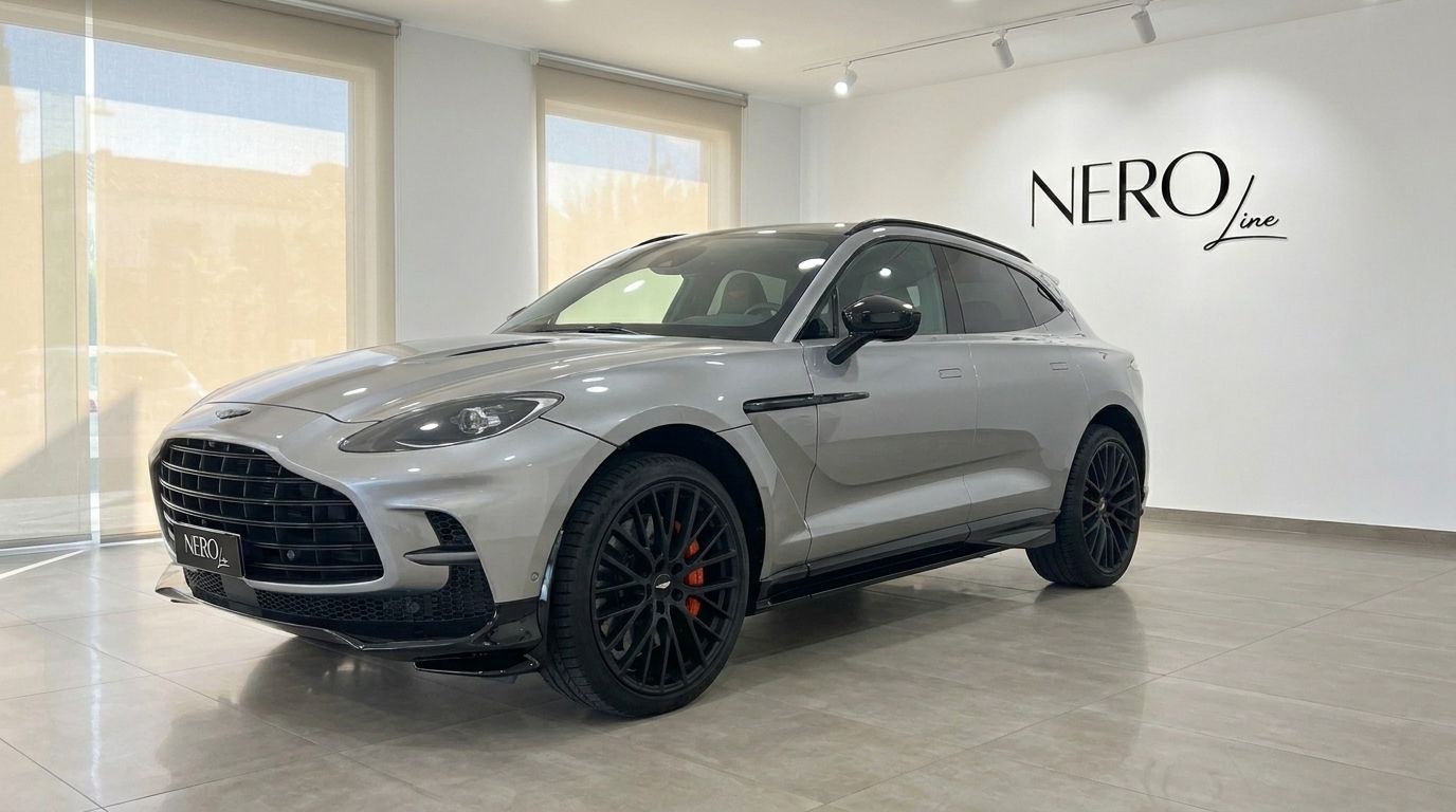 Metallic silver Aston Martin DBX707 SUV from a front three-quarter view in a Madrid showroom.