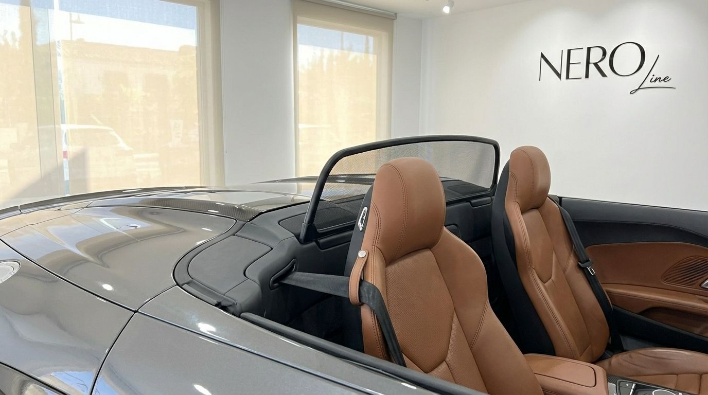 The luxurious brown leather interior seats and rear deck of the Audi R8 V10 Spyder Performance convertible in Marbella.