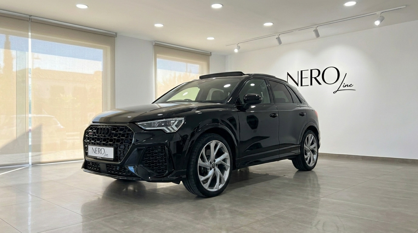 Audi RS Q3 — Front three-quarter view, Alicante The 2022 black Audi RS Q3 performance SUV is showcased from a front three-quarter angle in a bright Alicante showroom.