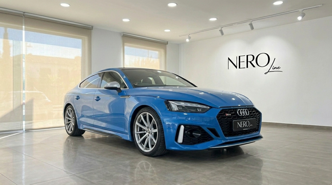 Audi RS5 — Front three-quarter view Alicante Blue 2020 Audi RS5 luxury car, shown from the front three-quarter angle in a showroom in Alicante.