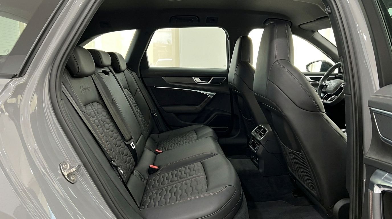 The luxurious rear Valcona leather seats with RS logo and honeycomb stitching in the 2026 Audi RS6 Avant, available in Ibiza.