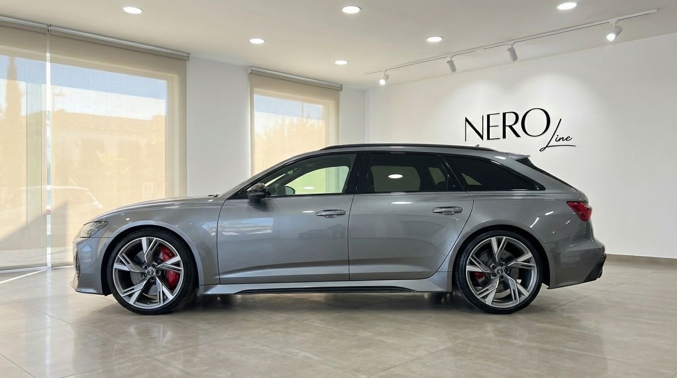 The matte gray Audi RS6 Avant is showcased from a side profile indoors, highlighting its sleek design in Marbella.
