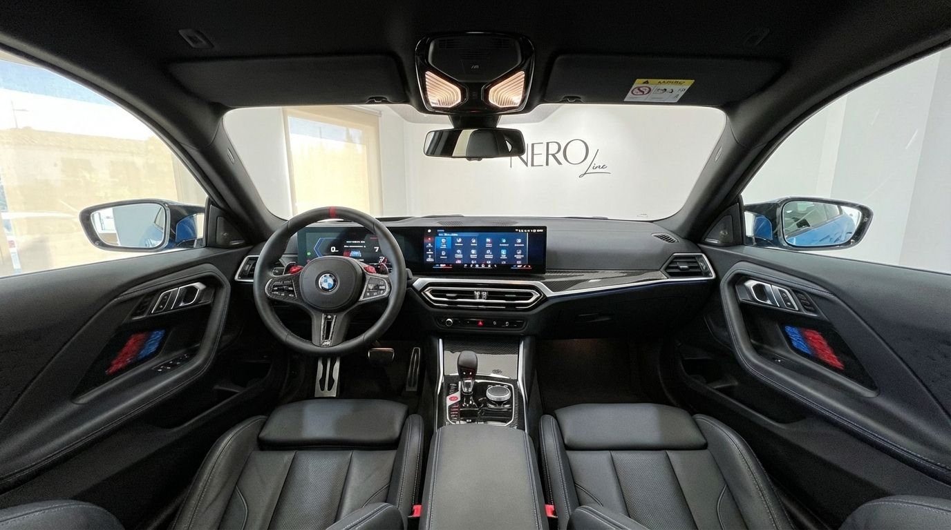 The luxurious interior of the 2025 BMW M2 Competition in Alicante, featuring its advanced cockpit and dashboard.
