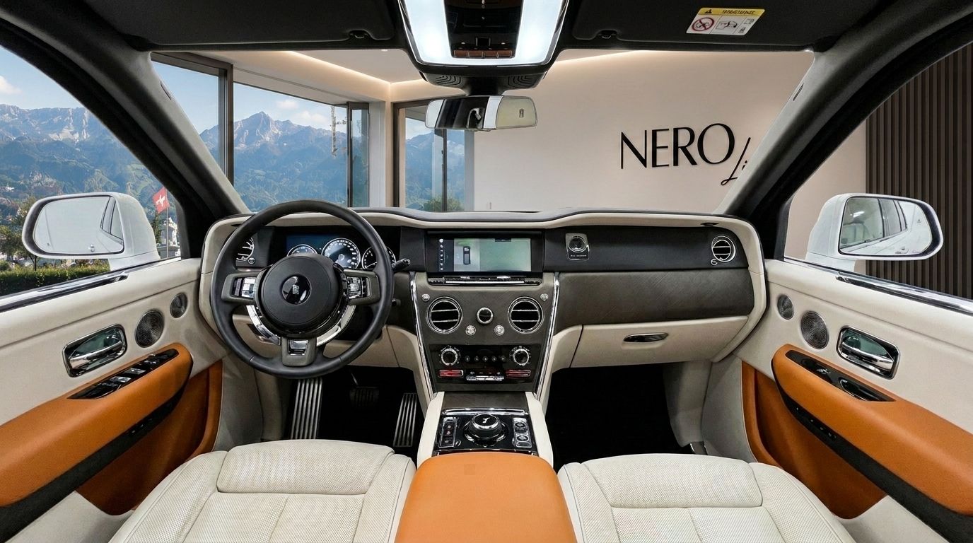 Rolls Royce Cullinan interior in Zurich, featuring the luxurious cream and tan dashboard, steering wheel, and infotainment screen with mountain views.