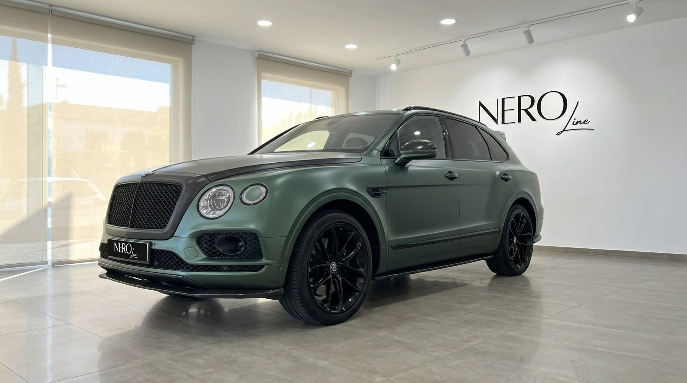 Bentley Bentayga — Elegant front view in Valencia The 2019 Bentley Bentayga in Satin British Racing Green, showcasing its elegant front three-quarter view in Valencia.