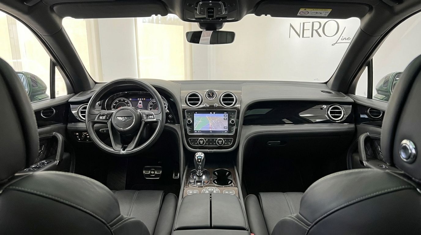 The luxurious interior of the Bentley Bentayga in Valencia, featuring the dashboard, steering wheel, and navigation screen.