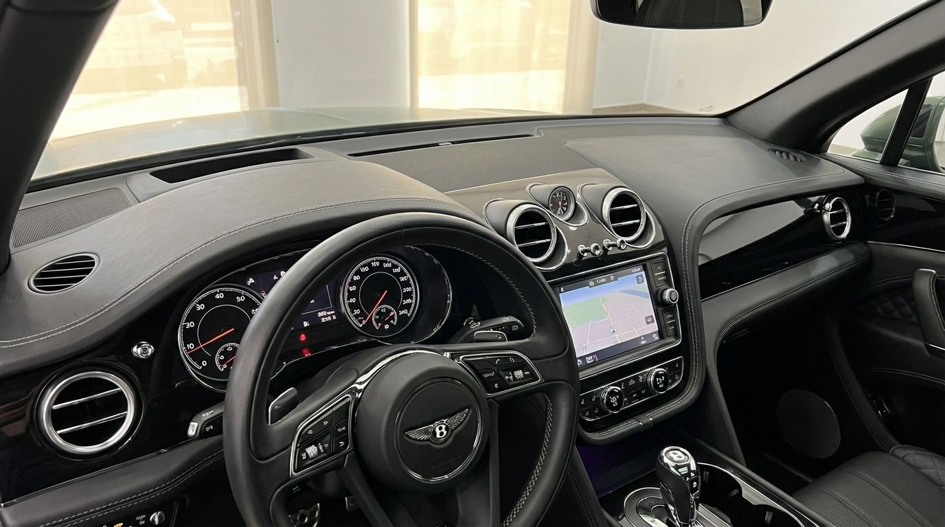 The luxurious interior of the Bentley Bentayga in Valencia, showcasing the detailed dashboard, steering wheel, and infotainment system.