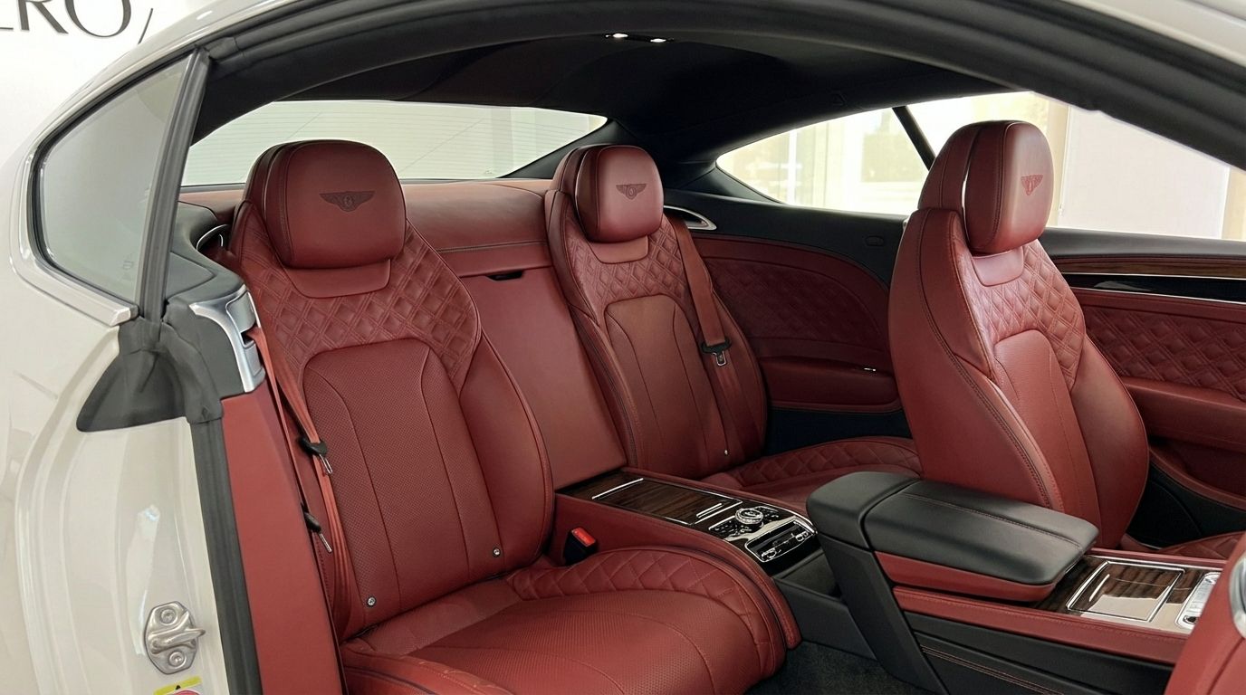 The luxurious red diamond-quilted leather rear and front passenger seats of the Bentley Continental GTC in Barcelona.