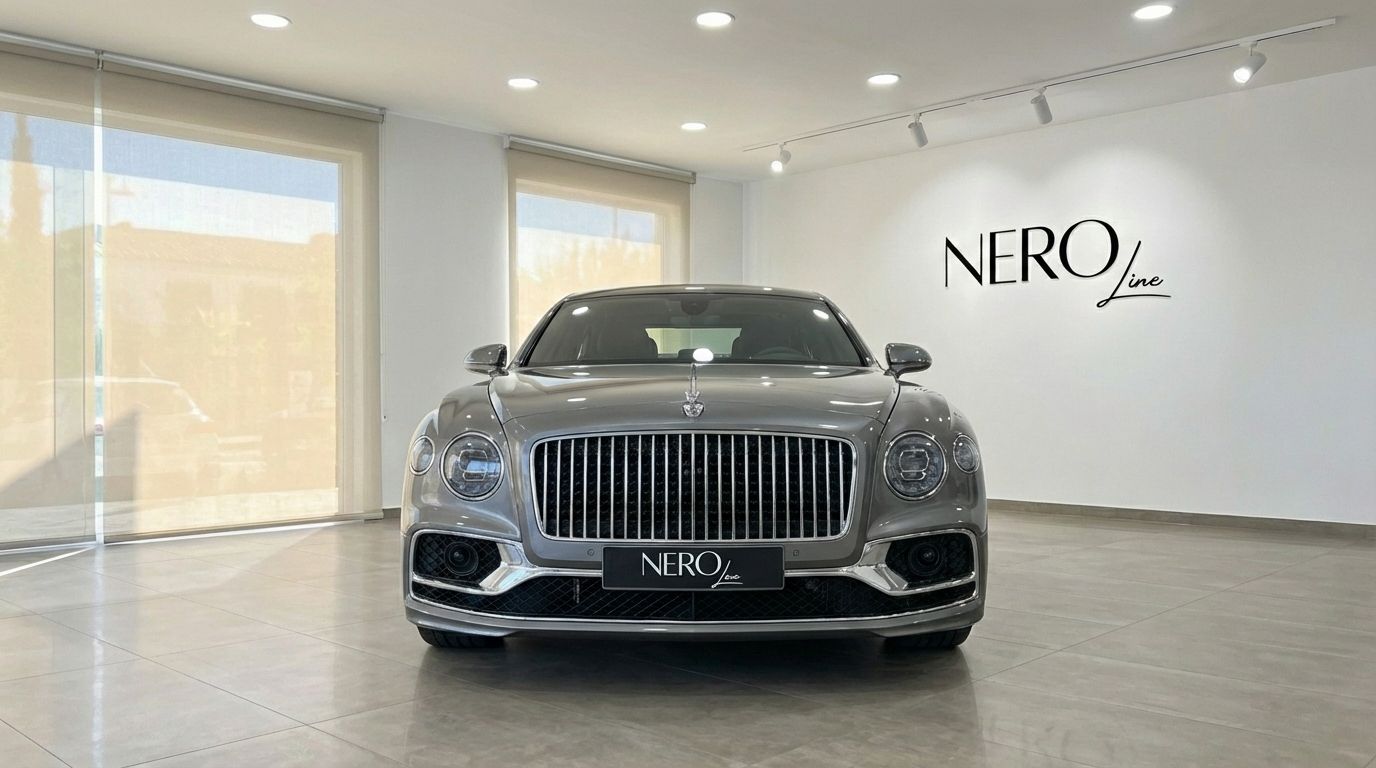 The metallic gray Bentley Flying Spur Special is prominently displayed from the front in a bright Marbella showroom.