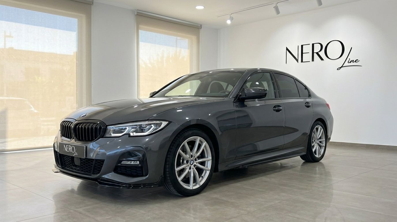 The dark grey BMW 320d is showcased in a front three-quarter view within a bright showroom in Alicante.