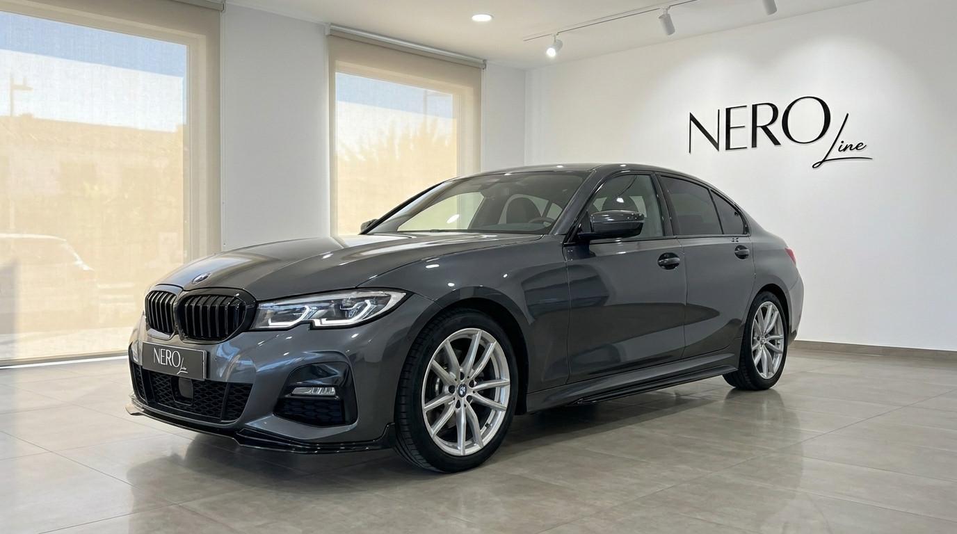 BMW 320d — Front three-quarter view Alicante The dark grey BMW 320d is showcased in a front three-quarter view within a bright showroom in Alicante.