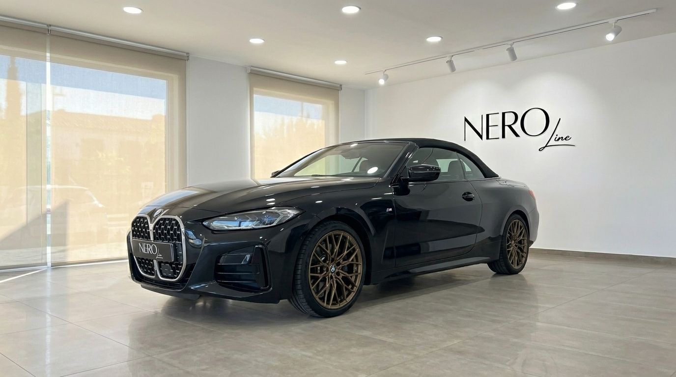 The gloss black 2023 BMW 430i M Convertible is showcased from a front three-quarter angle in a Benidorm showroom.