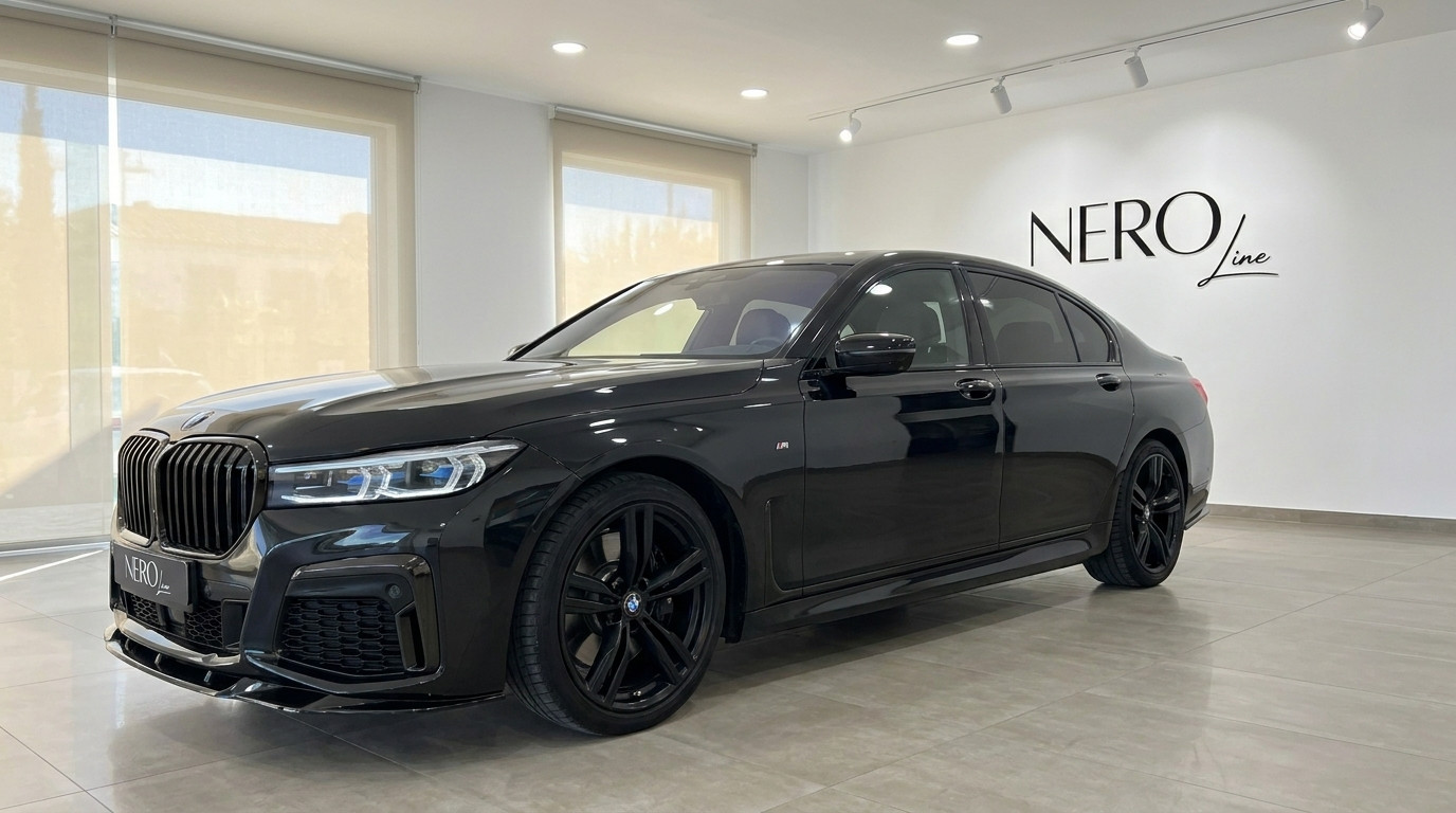 BMW 730 — Luxury Sedan in Alicante Showroom Black BMW 730 luxury sedan displayed in a showroom with the Nero Line logo on the wall in Alicante.