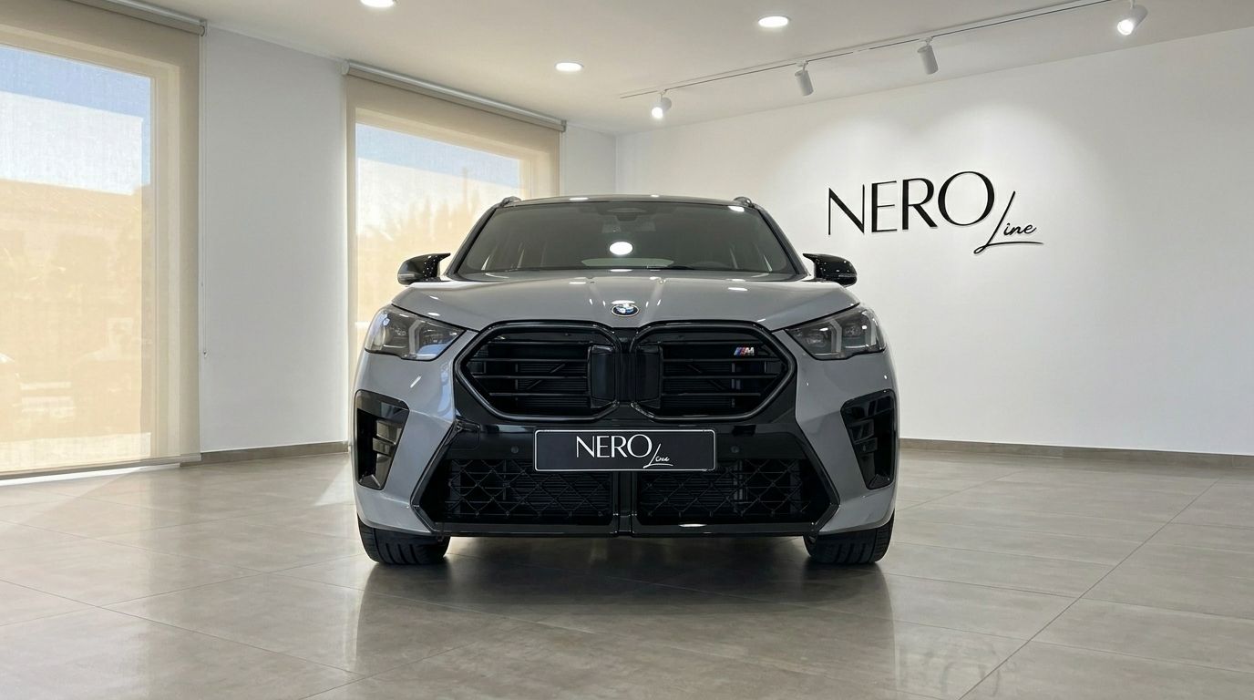 The grey 2024 BMW X2 M35i xDrive is prominently displayed from the front in a bright showroom in Marbella.
