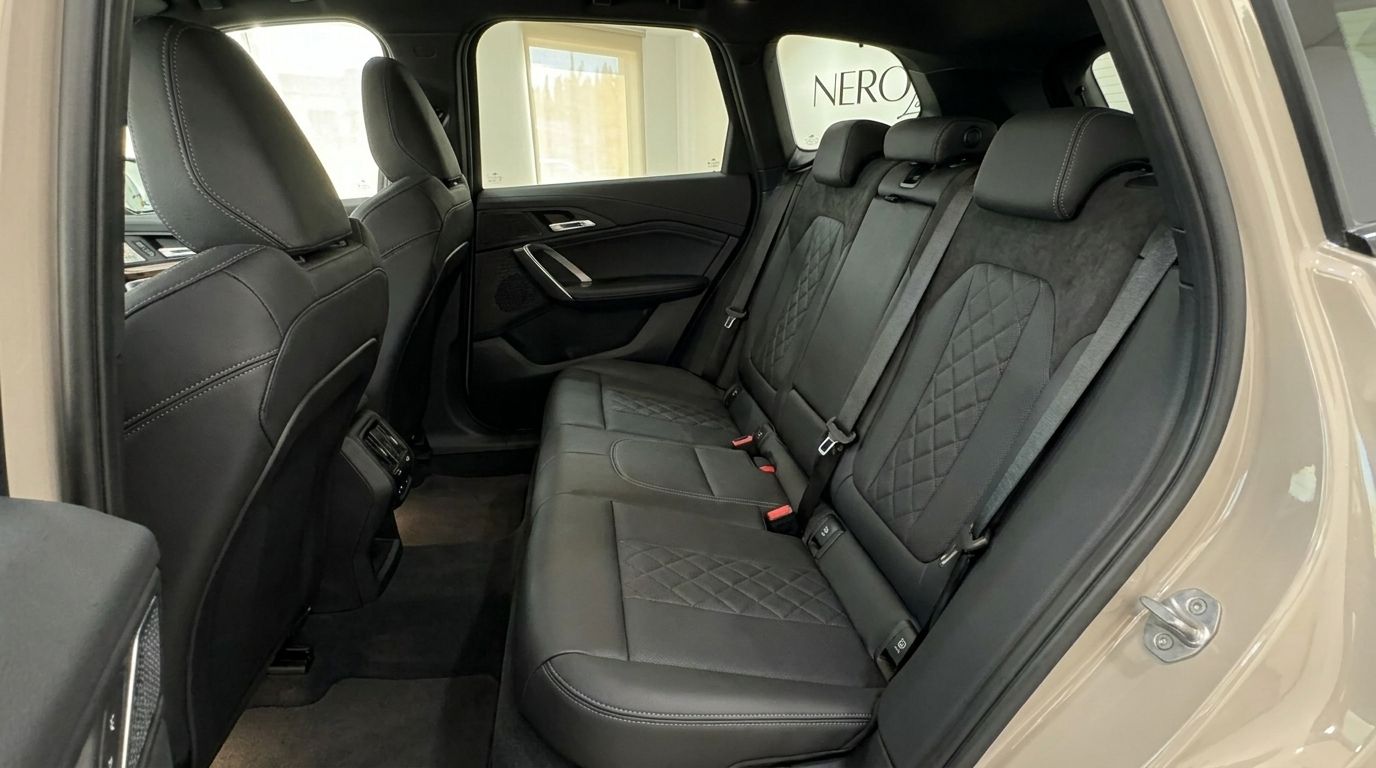 The luxurious black leather rear seats with diamond stitching in the 2026 BMW X3 2.0 Diesel in Alicante.