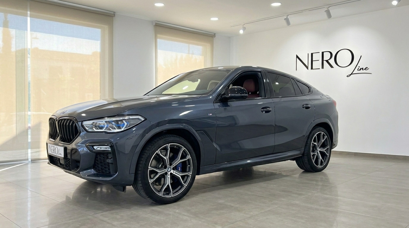 BMW X6 — Luxury SUV in Alicante Showroom A dark grey 2020 BMW X6 luxury SUV is showcased from a front three-quarter view inside a bright NEROline showroom in Alicante.