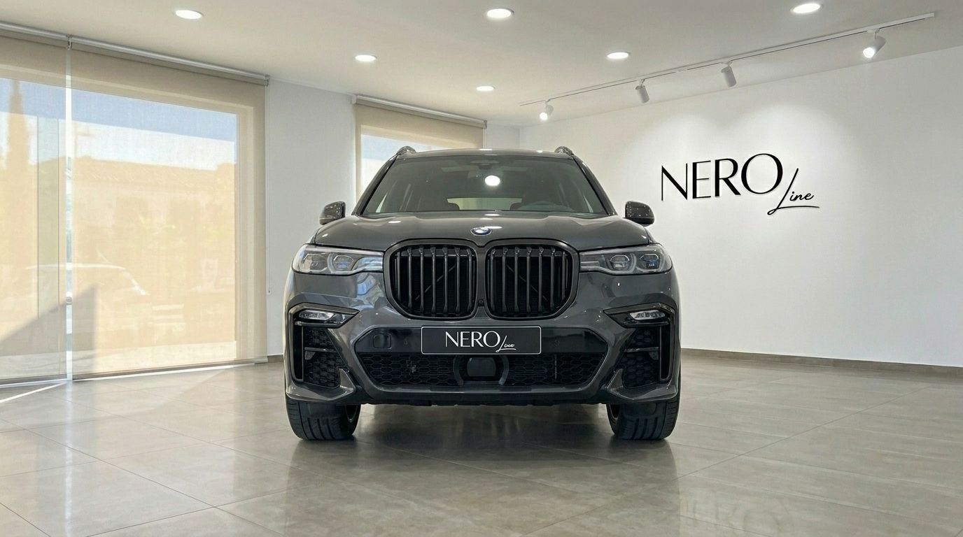 Front view of the Gloss Dark Grey 2021 BMW X7 M50i SUV in a bright Benidorm showroom.
