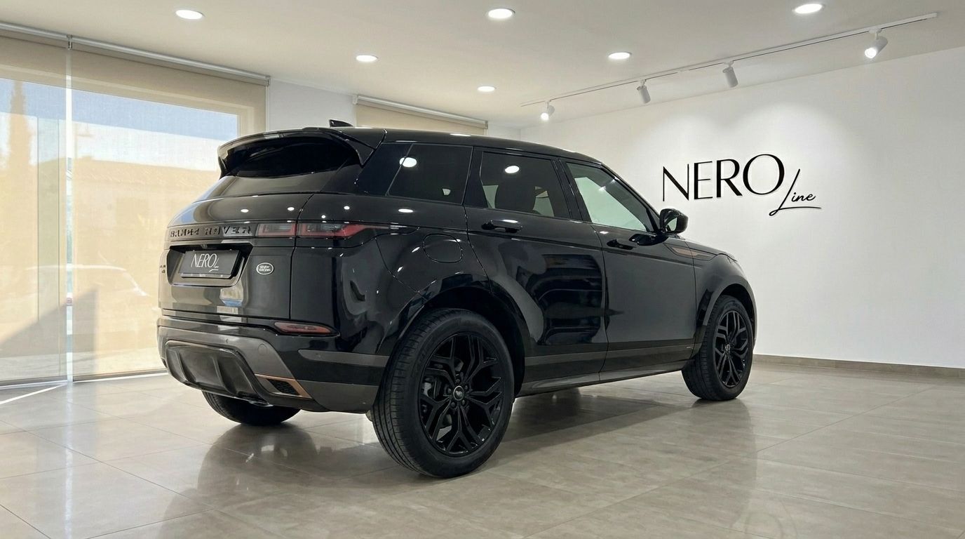 The black 2022 Land Rover Range Rover Evoque R-Dynamic (2nd) is showcased from a rear three-quarter angle in Alicante.