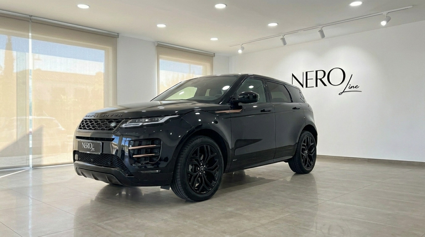 Land Rover Range Rover Evoque R-Dynamic — Showroom Alicante The black 2022 Land Rover Range Rover Evoque R-Dynamic is showcased from a front three-quarter view in a modern showroom in Alicante.