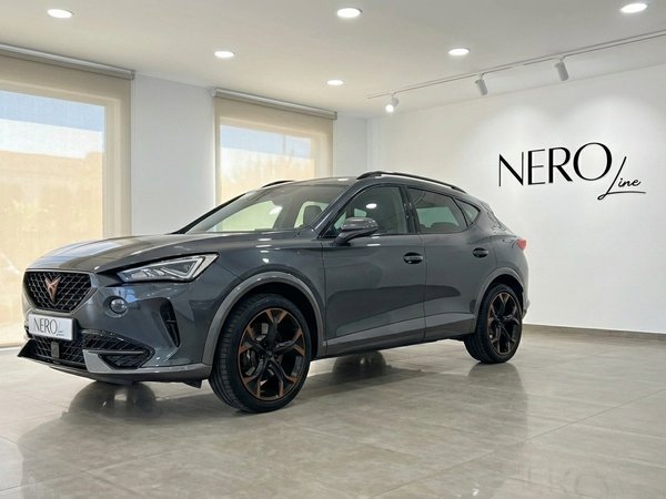 Cupra Formentor VZ — Front three-quarter view Marbella The Graphene Grey metallic Cupra Formentor VZ 2.0 TSI is showcased from a front three-quarter view in a Marbella showroom.