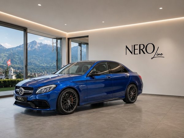 Mercedes-Benz C63S AMG — Showroom in Zurich A blue Mercedes-Benz C63S AMG, front three-quarter view, in a showroom with panoramic mountain and town views in Zurich.