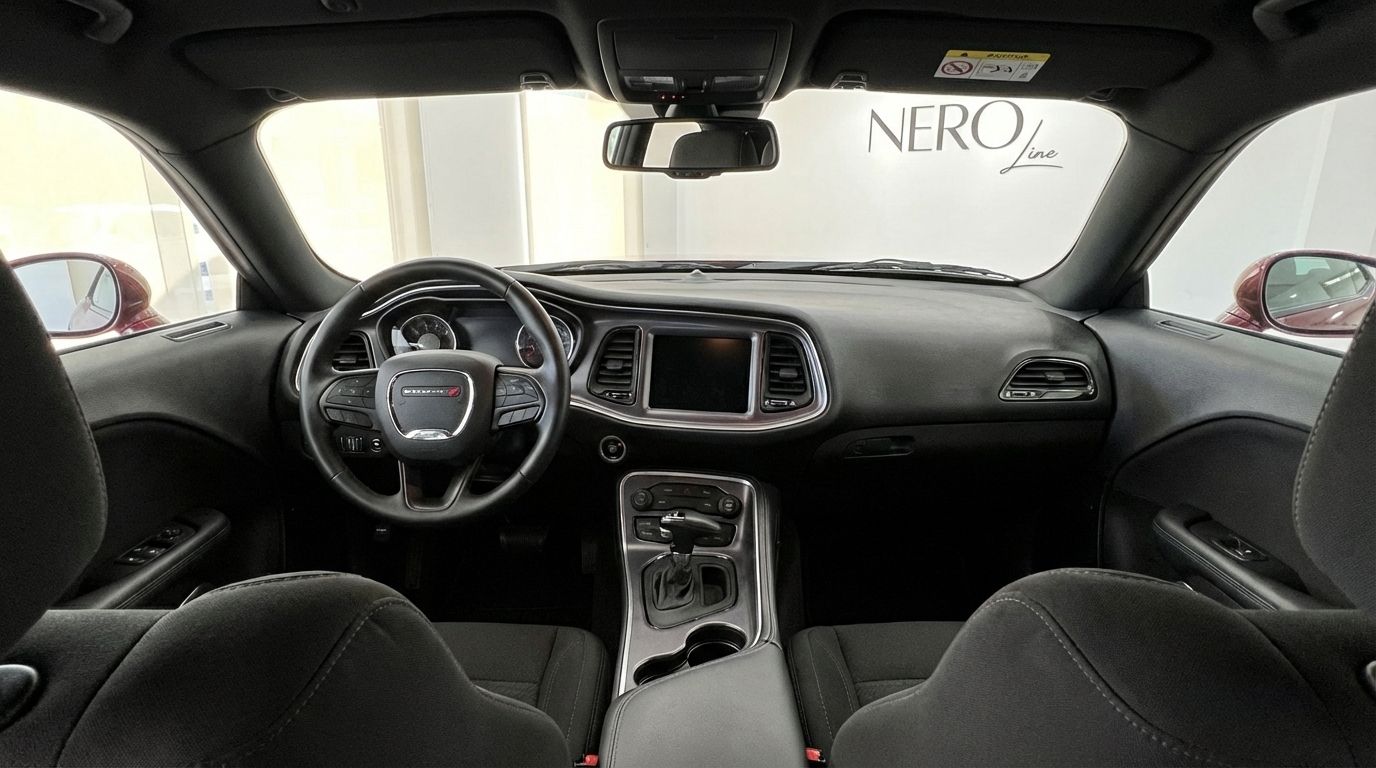 The spacious interior of the 2023 Dodge Challenger V6 in Alicante, featuring the dashboard, steering wheel, and central console.
