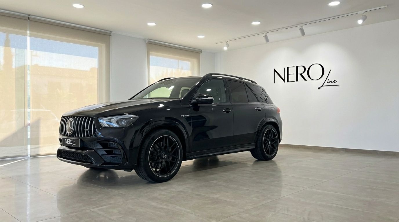 The glossy black 2022 Mercedes-Benz GLE 63s AMG is showcased from a front three-quarter angle in a bright Alicante showroom.
