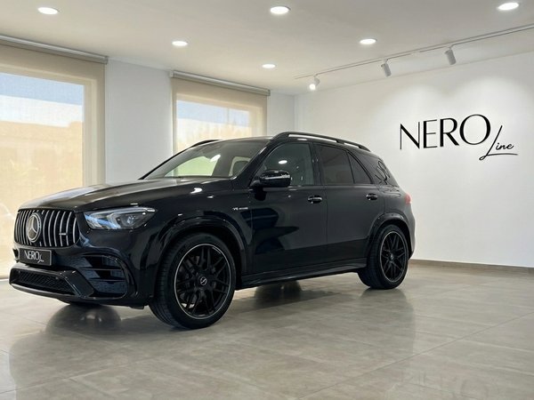 Mercedes-Benz GLE 63s AMG — Alicante showroom The glossy black 2022 Mercedes-Benz GLE 63s AMG is showcased from a front three-quarter angle in a bright Alicante showroom.