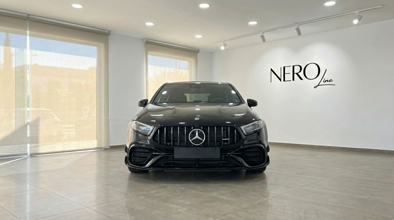 The metallic black 2024 Mercedes-Benz A 45 S is shown in a direct front view inside a showroom in Alicante.