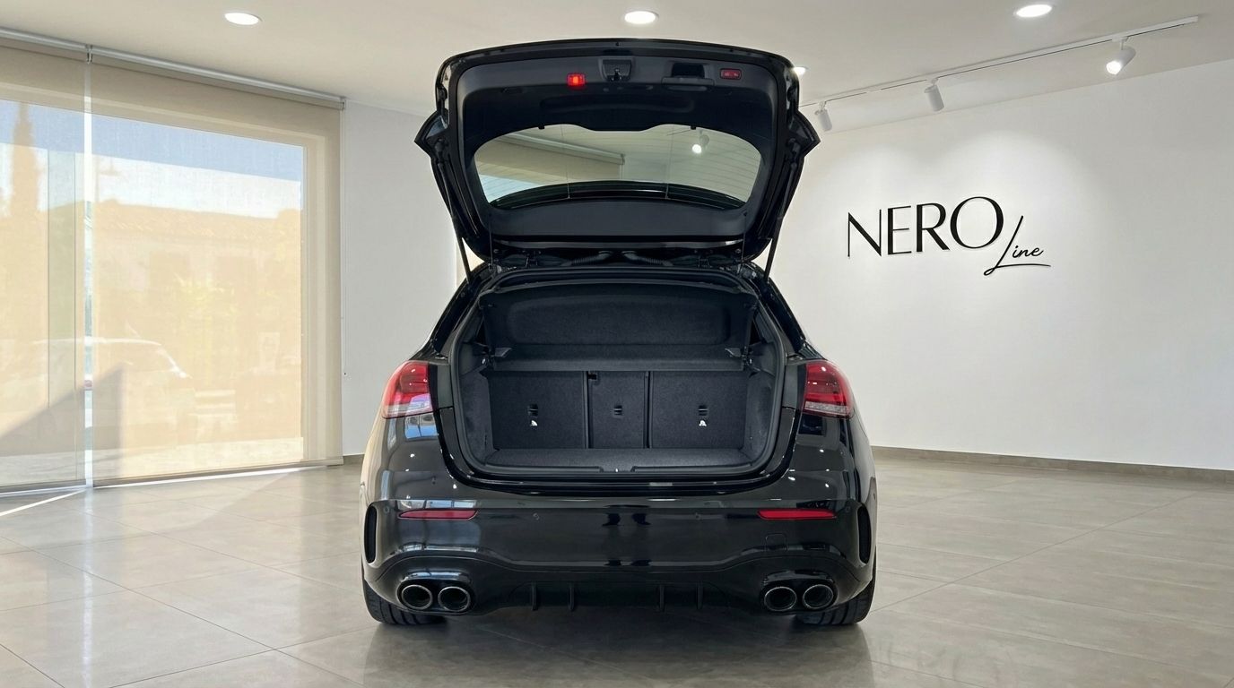 Rear view of a black Mercedes-Benz A 45 S with its trunk open, showcasing the cargo space in Alicante.